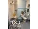 Cozy bathroom with tub-shower combo, light blue paint, and a blue and white rug at 3030 N 600 E, Lebanon, IN 46052