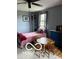 Bedroom featuring a small, dark metal bed frame, wooden chairs, and a table at 3030 N 600 E, Lebanon, IN 46052