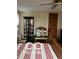 Bedroom featuring a bed, cabinet, dollhouse, and decorative display case at 3030 N 600 E, Lebanon, IN 46052
