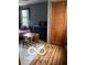 Bedroom featuring a small, dark metal bed frame, wooden chairs, and a table at 3030 N 600 E, Lebanon, IN 46052