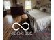 Comfortable bedroom with natural light, a wrought iron bed, and lustrous hardwood floors at 3030 N 600 E, Lebanon, IN 46052