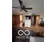 Spacious bedroom featuring wood floors, a ceiling fan, and double sliding closet doors at 3030 N 600 E, Lebanon, IN 46052