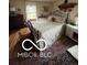 Cozy bedroom with a wrought iron bed, natural light from the window, and hardwood floors at 3030 N 600 E, Lebanon, IN 46052
