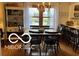 Well-lit dining room with wood floors, a dining table, and decorative furniture at 3030 N 600 E, Lebanon, IN 46052