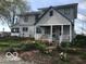 Charming home with a well-maintained lawn, lovely flowerbeds, and a welcoming front porch at 3030 N 600 E, Lebanon, IN 46052