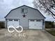 Spacious two car garage featuring two overhead doors at 3030 N 600 E, Lebanon, IN 46052