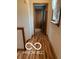 Hallway featuring hardwood floors, neutral walls, and views into adjacent rooms at 3030 N 600 E, Lebanon, IN 46052