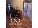Hallway with hardwood floors and bookshelf at 3030 N 600 E, Lebanon, IN 46052