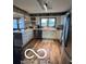 Well-lit kitchen featuring white cabinets, countertops, and stainless steel appliances at 3030 N 600 E, Lebanon, IN 46052