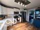 Well-lit kitchen featuring white cabinets, countertops, and stainless steel appliances at 3030 N 600 E, Lebanon, IN 46052