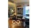 Inviting living room with hardwood floors, dining table, and decorative shelving unit at 3030 N 600 E, Lebanon, IN 46052