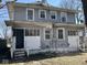 Rear exterior showing a two-story home with porch and yard at 3046 Central Ave, Indianapolis, IN 46205