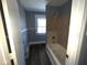 Full bath with a tub shower and window for light at 3046 Central Ave, Indianapolis, IN 46205