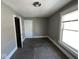 This bedroom features neutral paint, a window, and a light fixture at 3046 Central Ave, Indianapolis, IN 46205