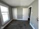 Neutral bedroom with a window and two doors at 3046 Central Ave, Indianapolis, IN 46205