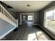 Open living area with staircase and new flooring at 3046 Central Ave, Indianapolis, IN 46205
