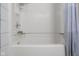 Clean bathroom tub and shower with blue and white shower curtain at 3104 S Pisgah Way, Columbus, IN 47203