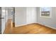 Bedroom with hardwood floors, closet, window, and neutral paint at 3104 S Pisgah Way, Columbus, IN 47203