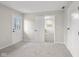 Bright bedroom featuring plush carpeting, white trim, and an ensuite entrance at 3104 S Pisgah Way, Columbus, IN 47203