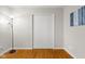 Bedroom showcasing hardwood floors, a closet, and modern decor at 3104 S Pisgah Way, Columbus, IN 47203
