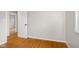 Bright room with hardwood floors and doorway to another room at 3104 S Pisgah Way, Columbus, IN 47203