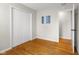 Bedroom with hardwood floors, closet and doorway to another room at 3104 S Pisgah Way, Columbus, IN 47203
