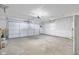Spacious garage with white walls, concrete floor, and white garage door at 3104 S Pisgah Way, Columbus, IN 47203