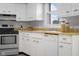 Up close view of kitchen featuring white cabinets, wood countertops, and stainless steel appliances at 3104 S Pisgah Way, Columbus, IN 47203