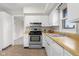 Bright kitchen features white cabinets, stainless steel appliances, and wood countertops at 3104 S Pisgah Way, Columbus, IN 47203