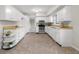 Bright kitchen featuring white cabinets, wood countertops, stainless steel appliances, and vinyl flooring at 3104 S Pisgah Way, Columbus, IN 47203