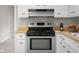 Kitchen showcases stainless steel oven, wood counters, and white cabinets at 3104 S Pisgah Way, Columbus, IN 47203