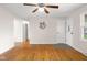 Inviting living room featuring hardwood floors, a ceiling fan, and neutral paint at 3104 S Pisgah Way, Columbus, IN 47203