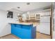 Basement bar with modern lighting, a mini fridge and tile floors at 325 W Greyhound Pass, Carmel, IN 46032