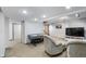 Relax in this finished basement with comfortable armchairs, an air hockey table, and ample lighting at 325 W Greyhound Pass, Carmel, IN 46032