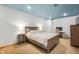Cozy bedroom featuring neutral tones, a comfortable bed, side tables, and ample closet space at 325 W Greyhound Pass, Carmel, IN 46032