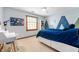Comfortable bedroom with a modern decor, desk, and white floors at 325 W Greyhound Pass, Carmel, IN 46032