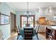 Cozy dining area with chandelier lighting, table, and chairs adjacent to the kitchen at 325 W Greyhound Pass, Carmel, IN 46032
