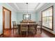 Traditional dining room with hardwood floors, chair railing, and a modern light fixture at 325 W Greyhound Pass, Carmel, IN 46032