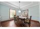 Dining room featuring hardwood floors, blue walls and traditional trim at 325 W Greyhound Pass, Carmel, IN 46032