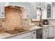 Close-up of the kitchen featuring granite countertops, tile backsplash, and stainless steel appliances at 325 W Greyhound Pass, Carmel, IN 46032