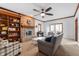 Comfortable living room featuring a brick fireplace, built-in shelving, and neutral tones at 325 W Greyhound Pass, Carmel, IN 46032