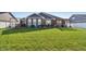 Expansive backyard with a well-manicured lawn and multiple outdoor living spaces at 3254 S Ansley Dr, New Palestine, IN 46163