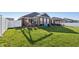 Spacious backyard with lush green lawn and a patio featuring outdoor seating areas at 3254 S Ansley Dr, New Palestine, IN 46163
