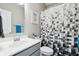 Stylish bathroom featuring modern sink, gray vanity, and patterned shower curtain at 3254 S Ansley Dr, New Palestine, IN 46163