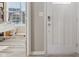 Bright entryway with a modern door and a glimpse of a home office at 3254 S Ansley Dr, New Palestine, IN 46163
