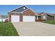 Inviting exterior with a well-kept lawn and double garage doors at 3254 S Ansley Dr, New Palestine, IN 46163