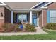 Inviting front porch with a blue door and stylish stone accents at 3254 S Ansley Dr, New Palestine, IN 46163