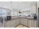 Spacious kitchen with stainless sink, sleek counter-tops, and open view to living area at 3254 S Ansley Dr, New Palestine, IN 46163