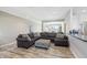 Spacious living room with a large sectional sofa and a view of the kitchen area at 3254 S Ansley Dr, New Palestine, IN 46163