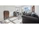 Inviting living room featuring natural light, neutral colors, and a comfortable seating arrangement at 3254 S Ansley Dr, New Palestine, IN 46163